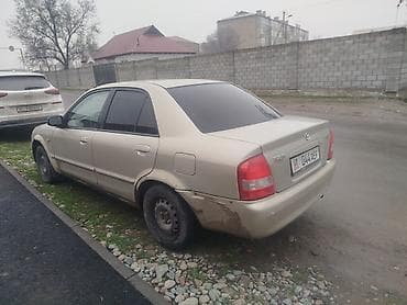 Транспорт: Mazda 323: 2001 г., 1.6 л, Кол менен иштөөчү, Бензин, Седан — 5