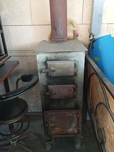 Металлическая твердотопливная печь с дымоходом Колдонулган абалы өтө