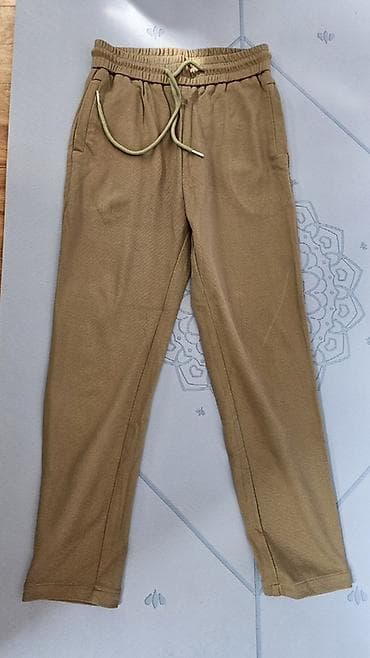 Женские брюки, цвет бежевый (песочный). Особенности: - Эластичный