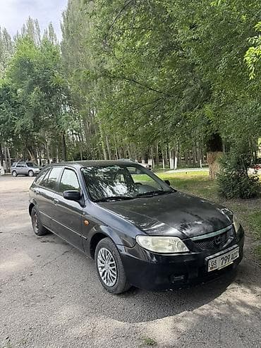 вампер 124: Mazda 323: 2001 г., 1.6 л, Механика, Бензин, Универсал — 1