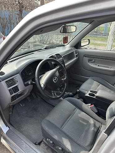 step vagon: Mazda Demio: 2003 г., 1.3 л, Ручные, Бензин, Универсал — 2