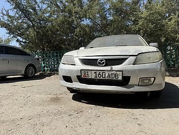 Mazda 323: 2001 г., 1.5 л, Автомат, Бензин, Универсал — 3