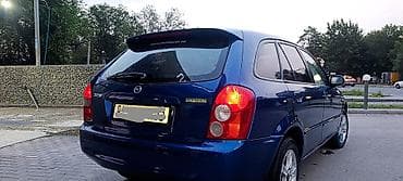 fit 2 2011: Mazda 323: 2003 г., 1.6 л, Механика, Бензин, Хэтчбэк — 5