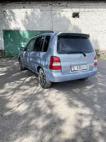 бар авто: Mazda Demio: 2001 г., 1.3 л, Кол менен иштөөчү, Бензин, Хетчбек — 9