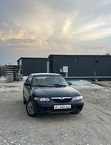 салон машины: Mazda 626: 1997 г., 2 л, Механика — 1