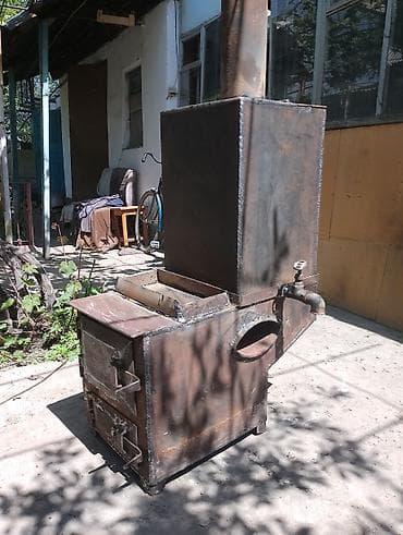 Печь-водогрейка на твердом топливе (самодельная стальная) -