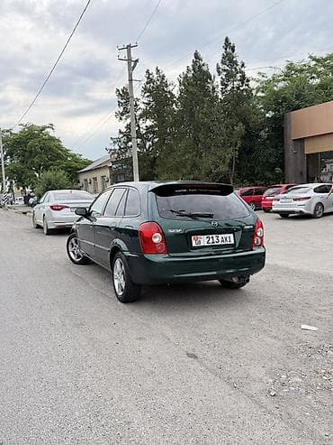 mistra: Mazda 323: 2003 г., 1.6 л, Автомат, Бензин, Универсал — 9