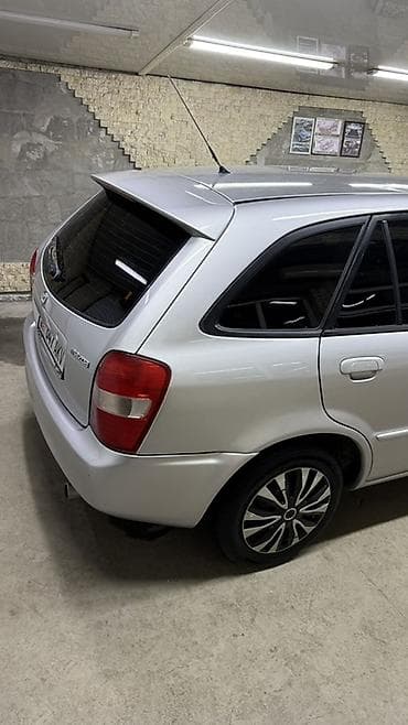 вместе дешевле: Mazda 323: 2001 г., 1.6 л, Механика, Бензин, Универсал — 3