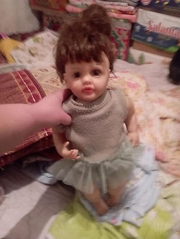 Кукла с реалистичным лицом и подвижными ручками/ножками. Особенности