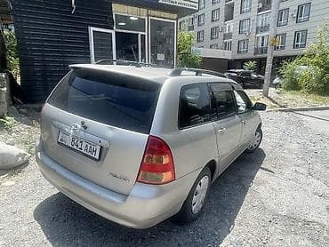 карол: Toyota Corolla: 2003 г., 1.5 л, Автомат, Бензин, Универсал — 2