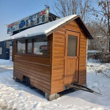 купить дом вагончик: Мобильный торговый павильон, выполненный в виде деревянного домика — 1