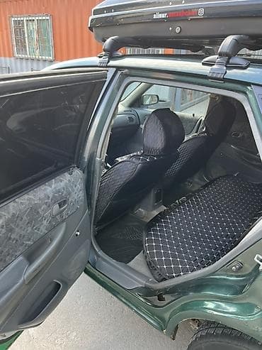 e 303: Mazda 323: 1999 г., 1.6 л, Механика, Бензин, Универсал — 9
