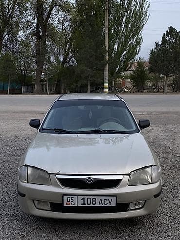 бампер мазда демио 2004: Mazda 323: 1998 г., 1.5 л, Механика, Бензин, Седан — 4