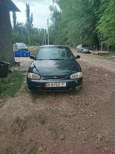 Транспорт: Kia Sephia: 1998 г., 1.5 л, Механика, Бензин, Седан — 5
