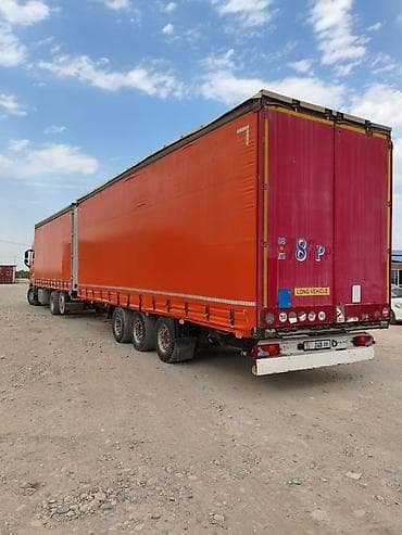 385 55: Тягач с автопоездом тентованный (еврофура + прицеп) Описание: - — 2