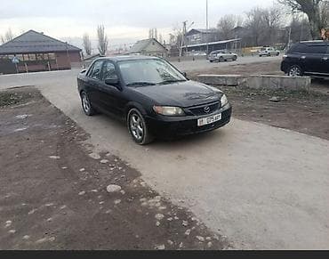 глушители авто: Mazda 323: 2001 г., 2 л, Автомат, Бензин, Седан — 4