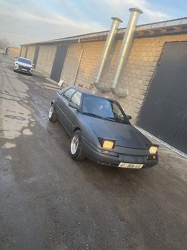 спартивный авто: Mazda 323: 1990 г., 1.6 л, Механика, Бензин, Седан — 3