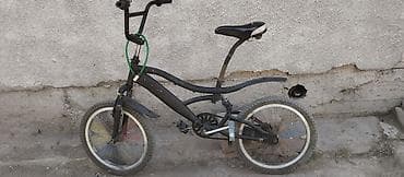 Детский/подростковый BMX-велосипед с небольшими колесами (примерно
