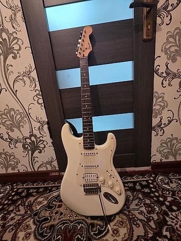 гитары токмок: Особенности: - Конфигурация звукоснимателей HSS: хамбакер в бридже и — 2