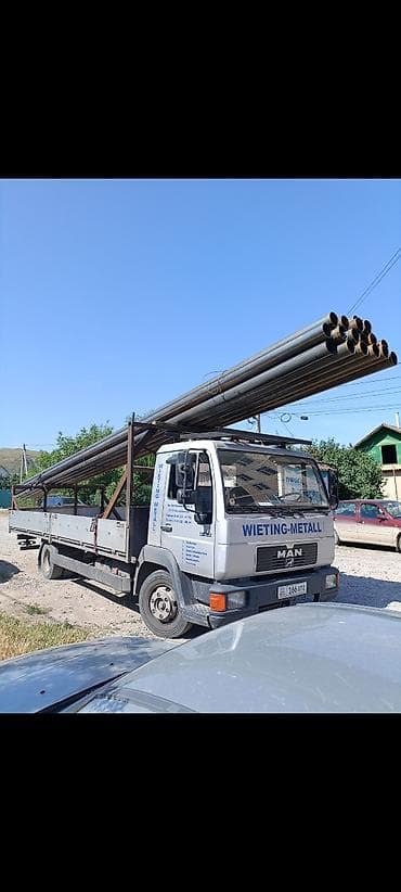 Услуги по перевозке длинномерных грузов на бортовом грузовике MAN. -