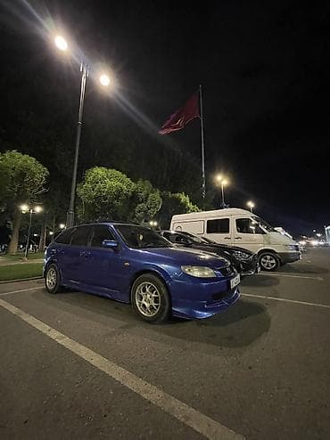 Mazda 323: 2002 г., 1.6 л, Кол менен иштөөчү, Бензин, Хетчбек — 9
