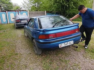 Транспорт: Mazda 323: 1990 г., Седан — 2
