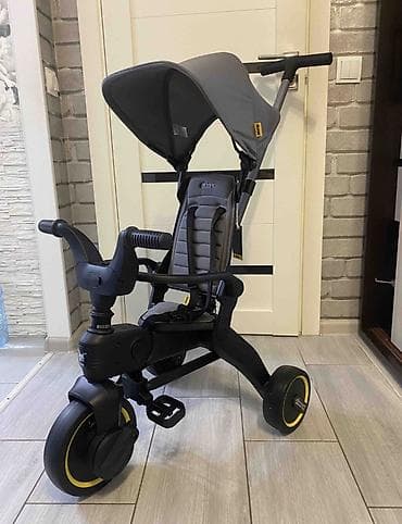 Детский транспорт: Детский трехколесный велосипед Doona Liki Trike - Компактный — 1