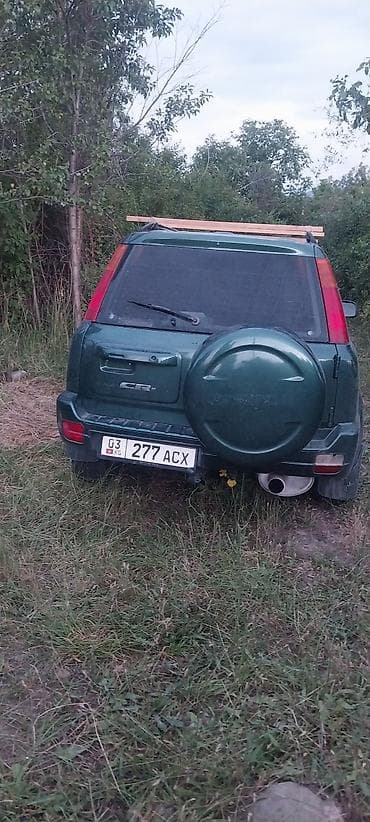 срв 4 поколения: Honda CR‑V I (рестайлинг), зелёный внедорожник/кроссовер. Кузов и — 4