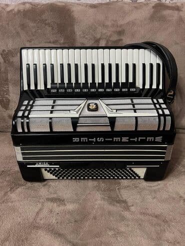 детское музыкальное пианино со стульчиком: Аккордеон Weltmeister (Германия), красный перламутровый корпус — 10