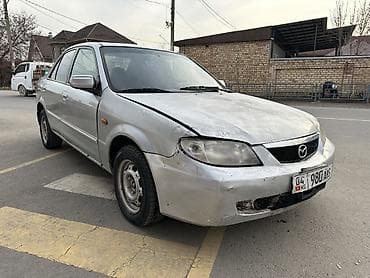 golf variant: Mazda 323: 2002 г., 1.6 л, Механика, Бензин, Седан — 2