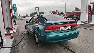 Транспорт: Mazda Cronos: 1996 г., 1.8 л, Кол менен иштөөчү, Бензин, Хетчбек — 4