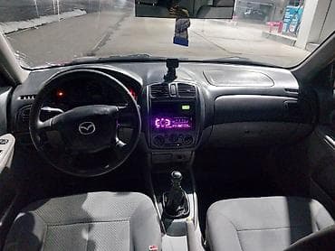 шлем токмок: Mazda 323: 2002 г., 1.5 л, Механика, Бензин, Универсал — 7