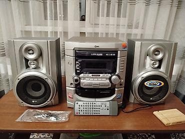 Музыкальный центр LG (микросистема) с двумя акустическими колонками. В