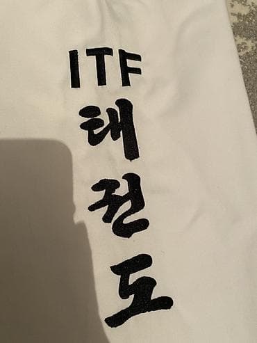 Спорт и отдых: Добок для тхэквондо ITF - Официальная вышивка ITF на груди: логотип — 9