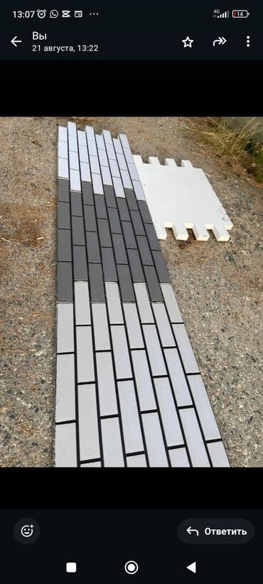 Панель для облицовки стен, имитирующая кирпичную кладку. Выполнена в