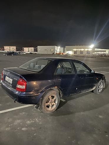 bmb 5: Mazda 323: 1999 г., 1.6 л, Механика, Бензин, Седан — 2