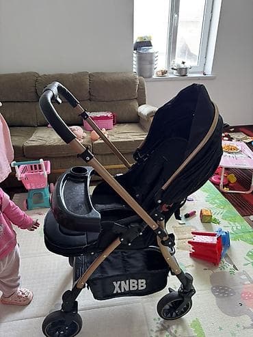Коляскалар: Удобная детская коляска XNBB в черном цвете с рамой под дерево — 4