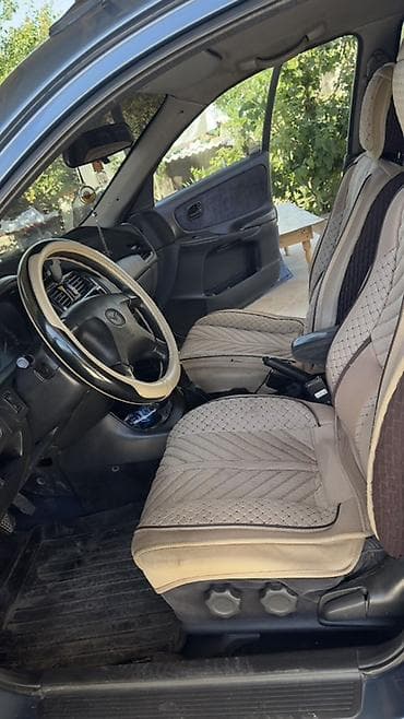 Mazda 626: 1997 г., 1.8 л, Механика, Газ, Седан