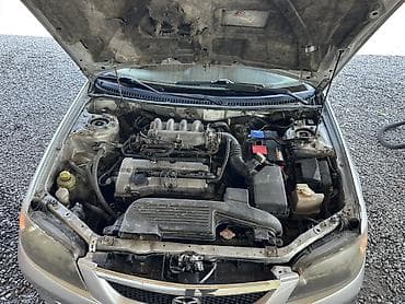 yamaha n max: Mazda 323: 2003 г., 1.6 л, Механика, Бензин, Хэтчбэк — 10