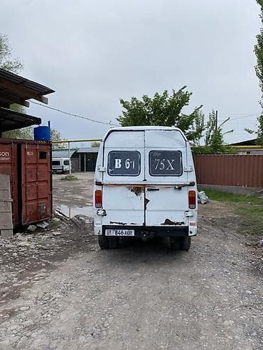 рекс пасажир: Длиннобазный фургон/микроавтобус (белый) с высоким крышей. Основные — 2