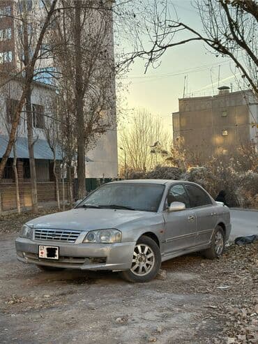 шипованные шины б у: Kia Magentis: 2001 г., 2 л, Механика, Газ, Седан — 1