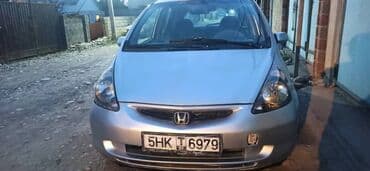машина ваз: Хэтчбек Honda Jazz серебристого цвета, представленный на изображениях — 8