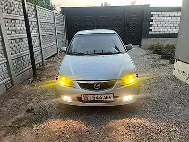 Mazda 323: 2001 г., 1.6 л, Механика, Бензин, Универсал