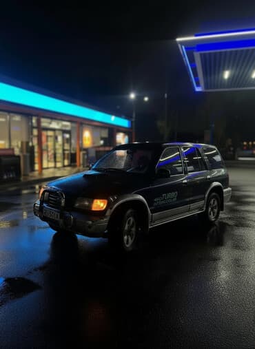 шипованные шины б у: Kia Sportage: 1996 г., 2 л, Механика, Бензиновая, Внедорожник — 1