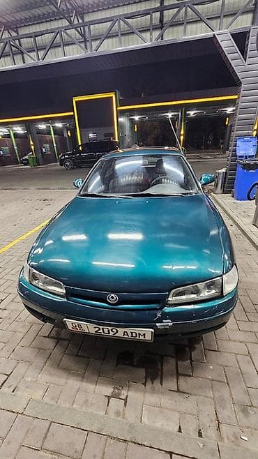 Продажа авто: Mazda 626: 1993 г., 2 л, Механика, Бензин, Хэтчбэк — 5