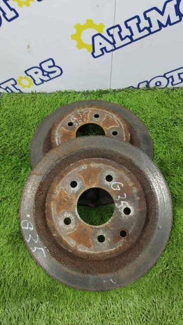 перфорированные тормозные диски: Задний тормозной диск Infiniti Б/у, Оригинал — 1