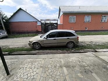 byd e2: Mazda 323: 1999 г., Механика, Бензин, Хэтчбэк — 10