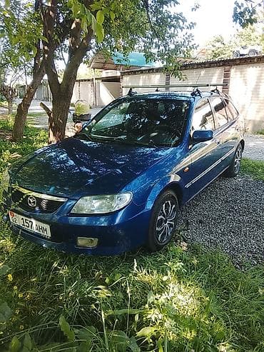 Mazda: Mazda 323: 2001 г., Механика, Бензин, Универсал — 1