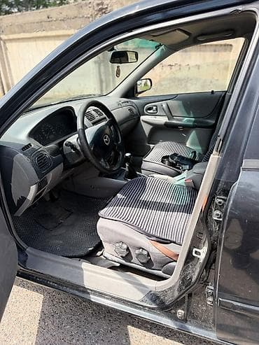 вампер 124: Mazda 323: 2001 г., 1.6 л, Механика, Бензин, Универсал — 5
