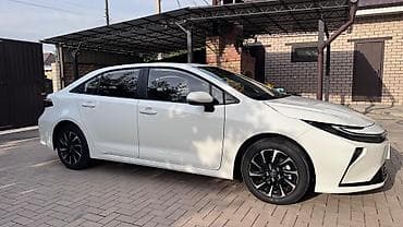 щиток: Toyota Corolla: 2026 г., Гибрид, Седан — 2